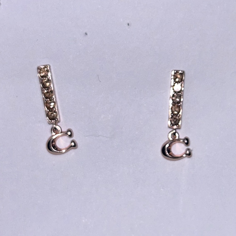 COACH gold earrings